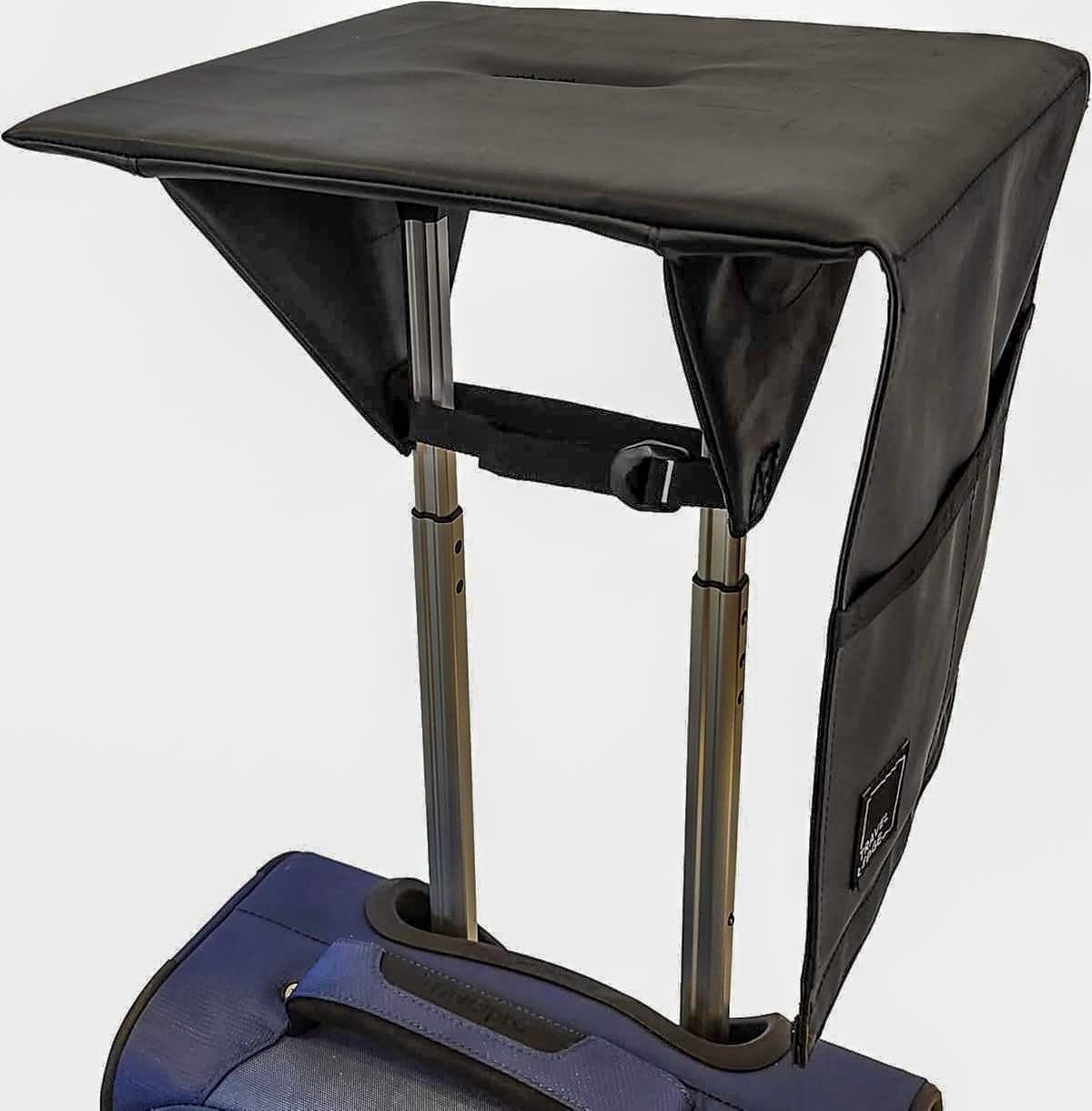 Travel Ledge secured across two separate telescoping luggage handle posts